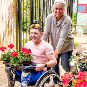 Man carrying flowerpots